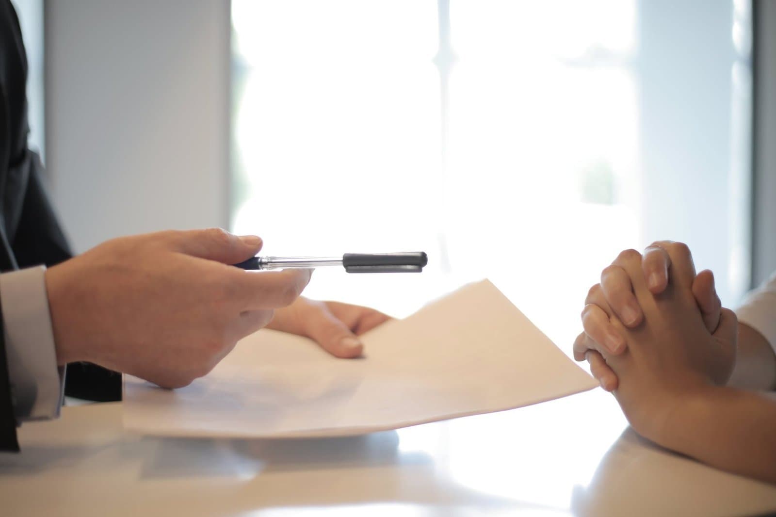 property management company giving contract to woman to sign
