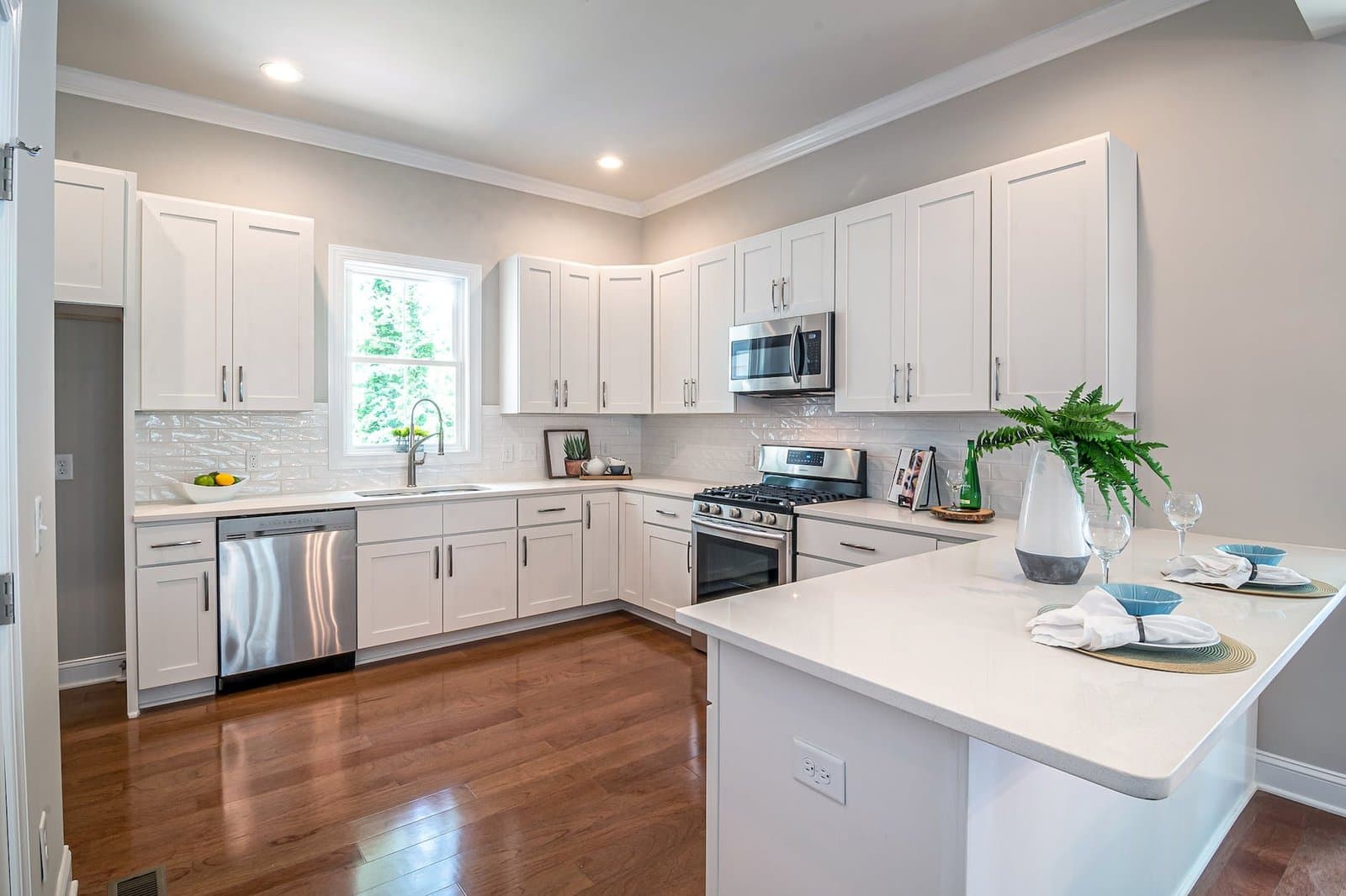 photo of white kitchen deciding to sell or rent your home